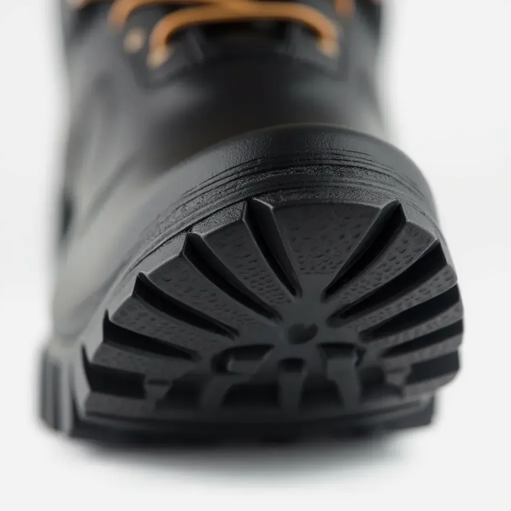 Haarlem boot sole showing aggressive lug tread pattern designed for wet pavement and cycling paths